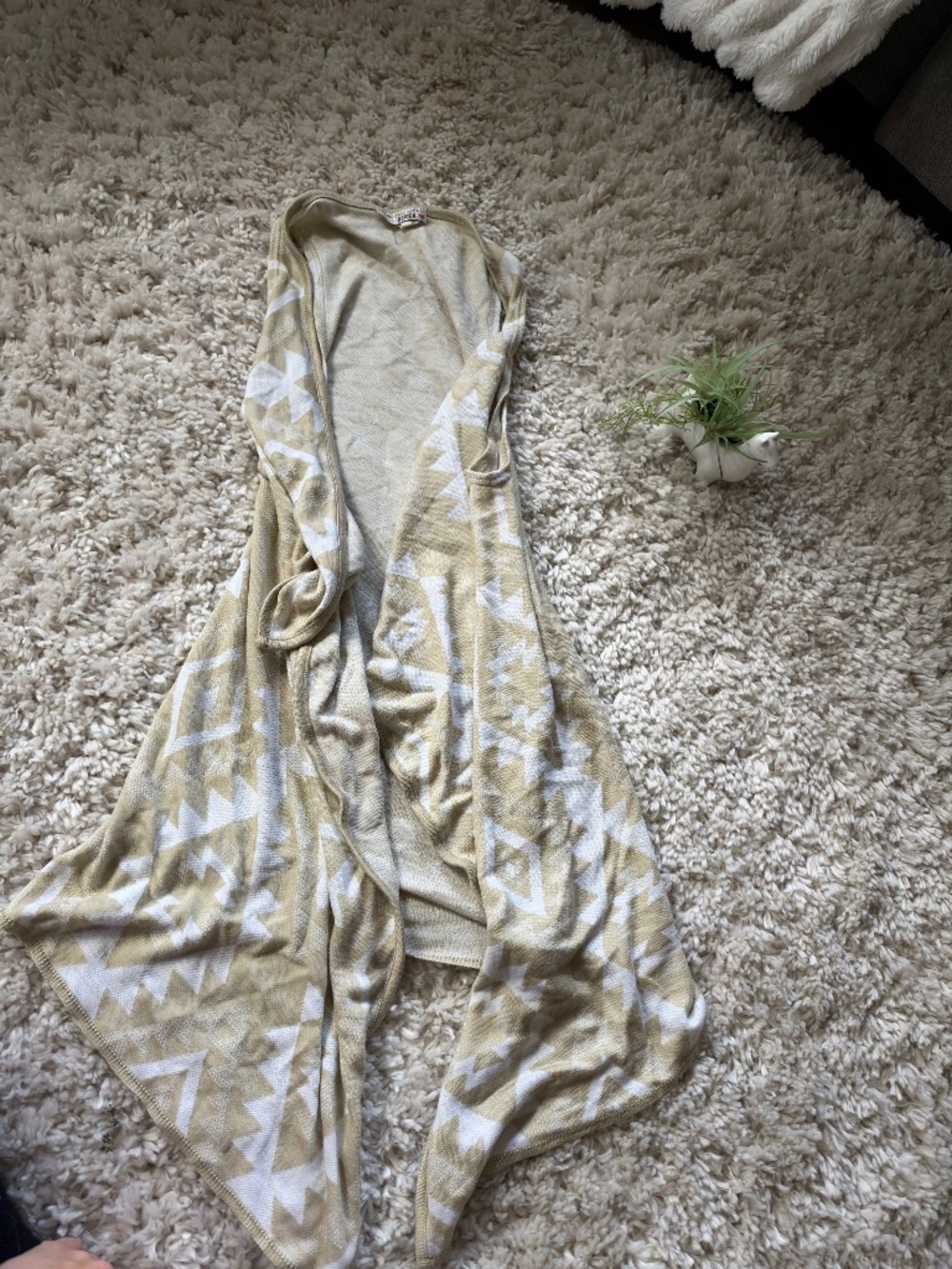 Love With Derek open-front shrug with a beige and white geometric pattern, drape
